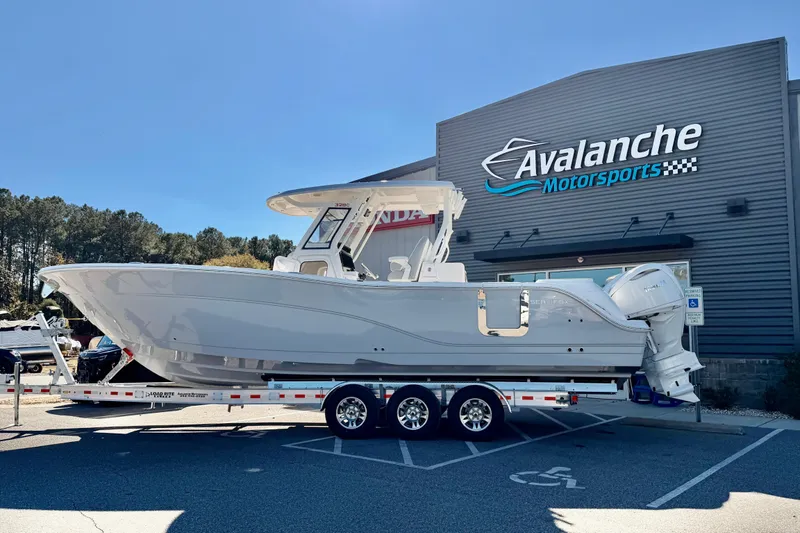 The Image of 2026 Sea Fox 328 Commander boat on trailer at Avalanche Motorsports dealership. - 1