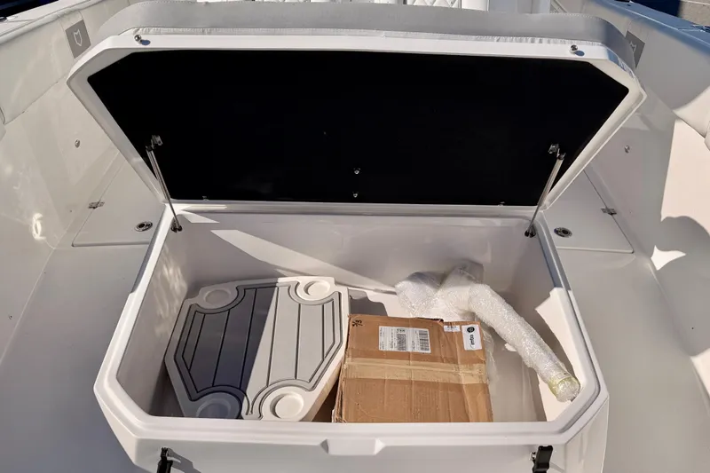 Slide: The Image of Storage compartment of 2026 Sea Fox 328 Commander boat, open with items inside. - 13