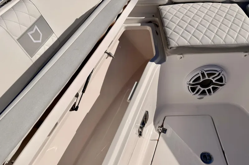 Slide: The Image of 2026 Sea Fox 328 Commander interior with storage compartment and speaker detail. - 14