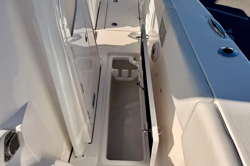 Slide: The Image of 2026 Sea Fox 328 Commander boat storage compartment with open hatch, showcasing interior features. - 15