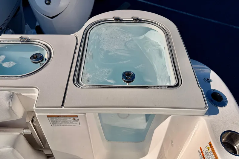 Slide: The Image of 2026 Sea Fox 328 Commander boat livewell with clear lid and sleek design. - 16
