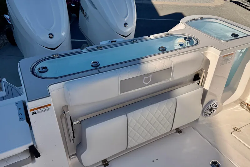 Slide: The Image of 2026 Sea Fox 328 Commander boat interior with Yamaha engines and seating area. - 17