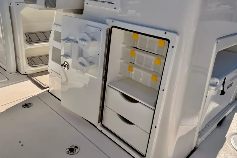 Slide: The Image of 2026 Sea Fox 328 Commander boat storage compartments with drawers and tackle boxes. - 23