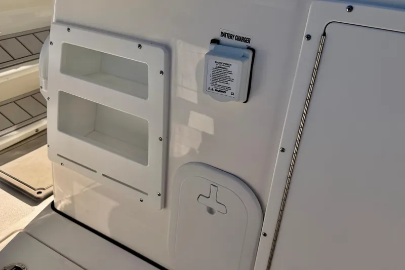Slide: The Image of 2026 Sea Fox 328 Commander boat interior with battery charger and storage compartments. - 28