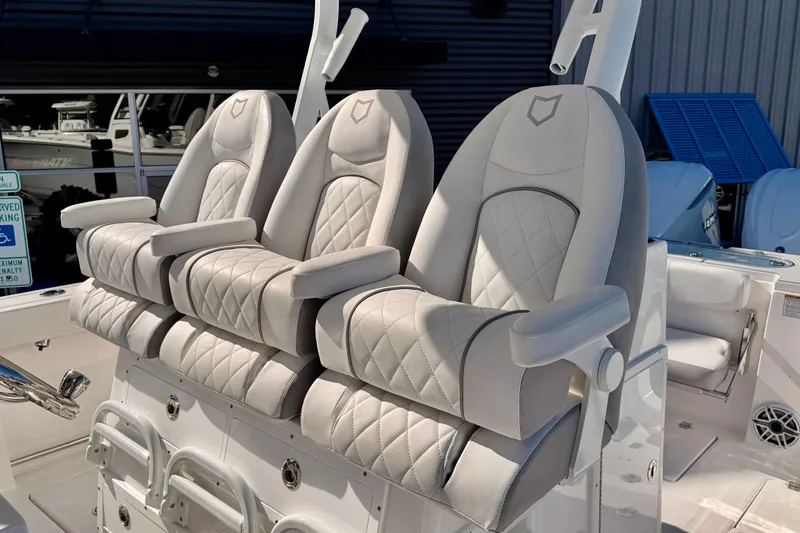 Slide: The Image of Luxurious seating on 2026 Sea Fox 328 Commander boat, featuring plush, diamond-stitched upholstery. - 30