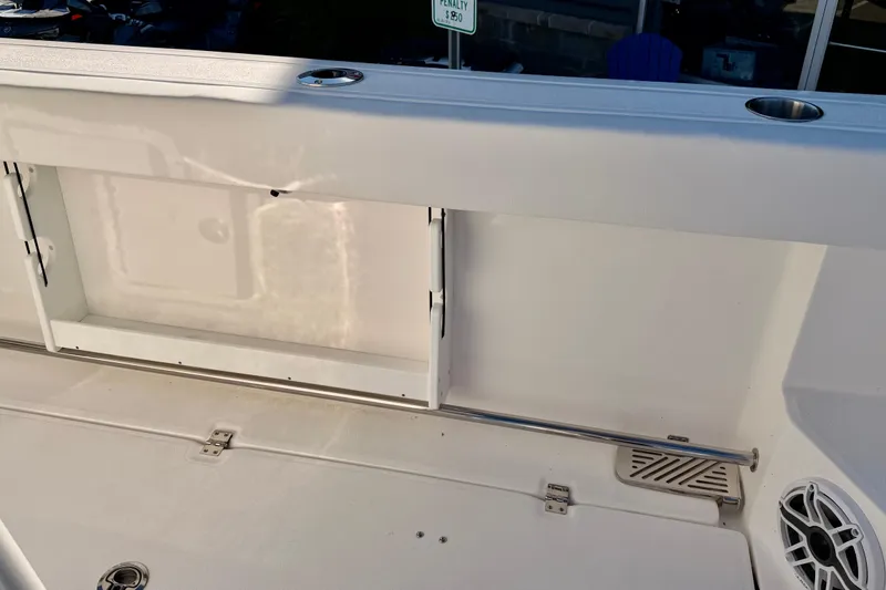 Slide: The Image of 2026 Sea Fox 328 Commander boat interior with storage compartment and speaker. - 36