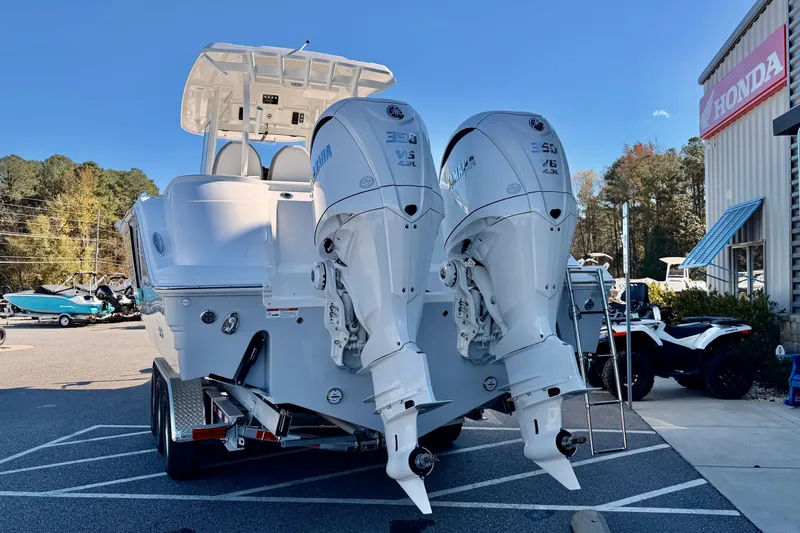 Slide: The Image of 2026 Sea Fox 328 Commander boat with dual Yamaha engines on a trailer. - 4