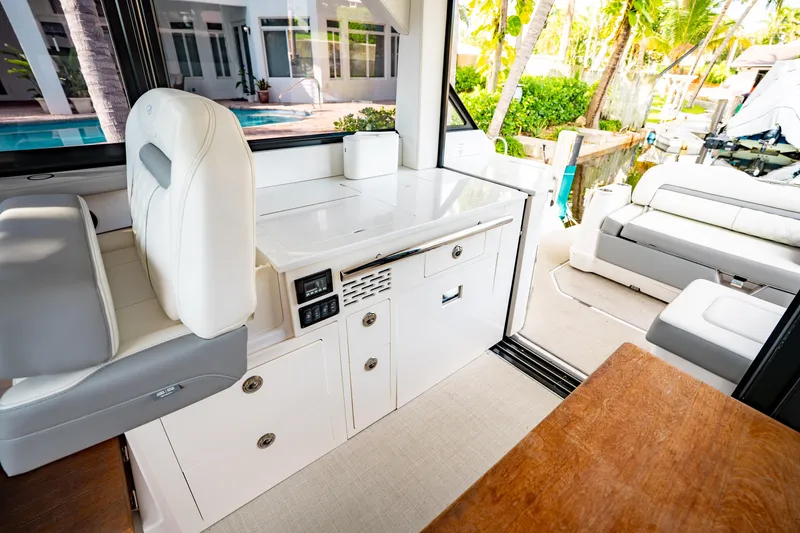 Slide: The Image of Luxurious interior of 2022 Regal 36 XO yacht with modern seating and cabinetry. - 22