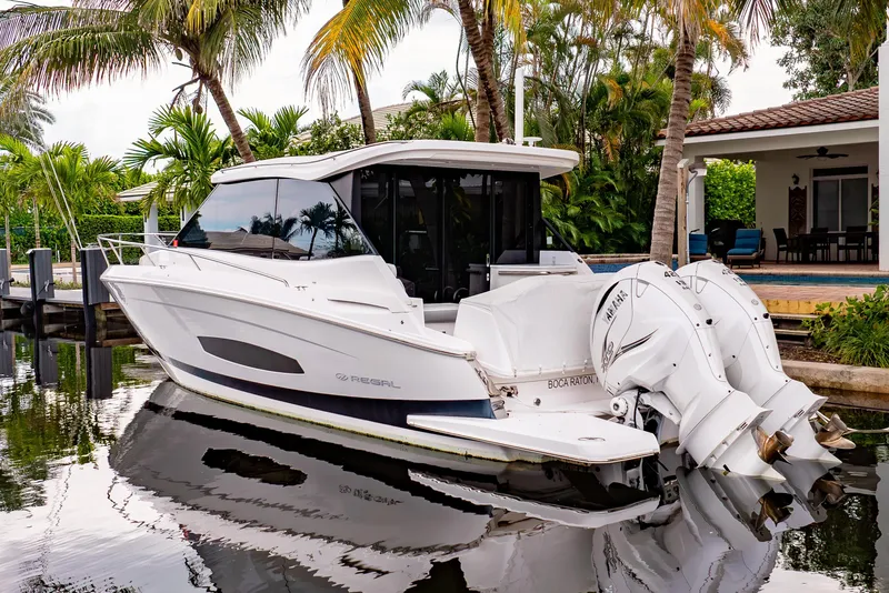 Slide: The Image of Luxurious interior of 2022 Regal 36 XO yacht with plush seating and wooden table. - 29