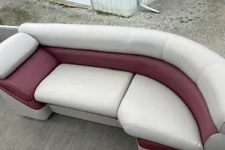 Slide: The Image of 2013 Premier 220 SunSation boat seating with beige and maroon upholstery. - 4