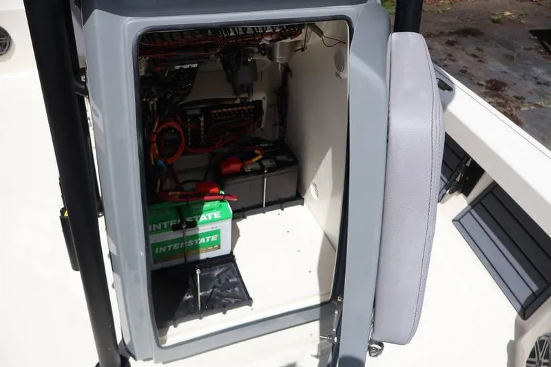 Slide: The Image of Open compartment of 2025 Pathfinder 2200 TRS boat showing battery and wiring. - 10
