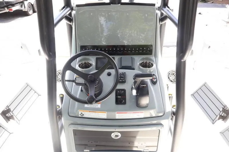 Slide: The Image of 2025 Pathfinder 2200 TRS boat console with steering wheel and controls. - 12