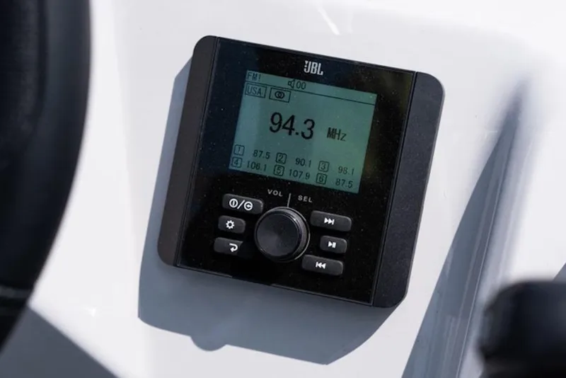 Slide: The Image of JBL radio display on 2026 Bentley Pontoons 223 Bolt Tri-Toon, showing 94.3 MHz frequency. - 13