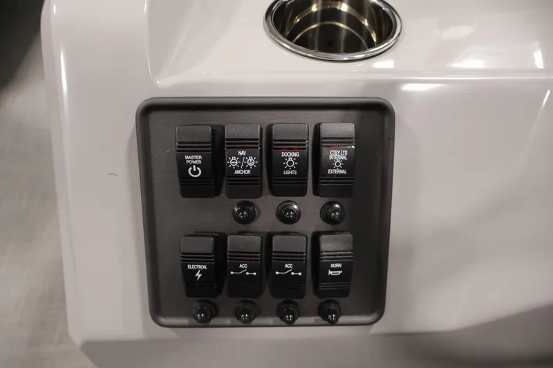 Slide: The Image of Control panel of 2026 Bentley Pontoons 223 Bolt Tri-Toon with various switches. - 22