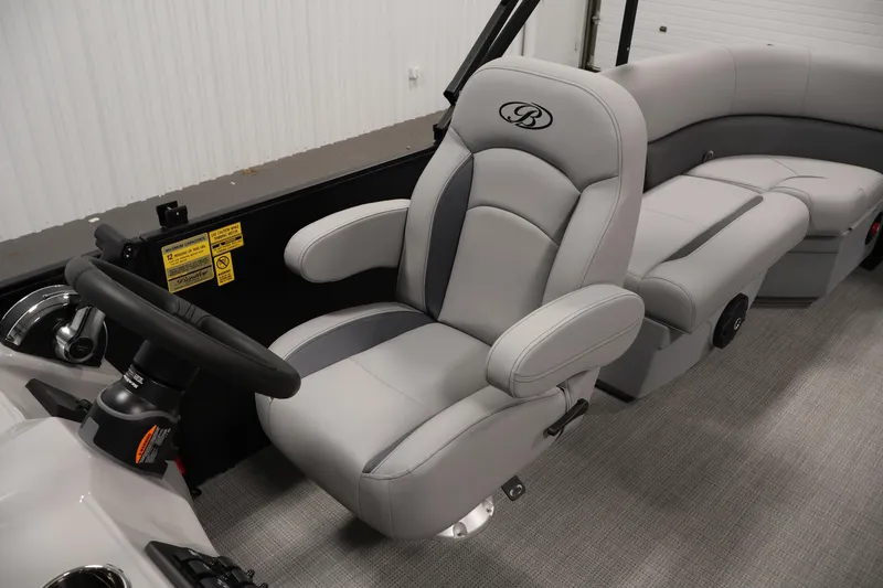 Slide: The Image of 2026 Bentley Pontoons 223 Bolt Tri-Toon interior with luxurious seating and steering wheel. - 25