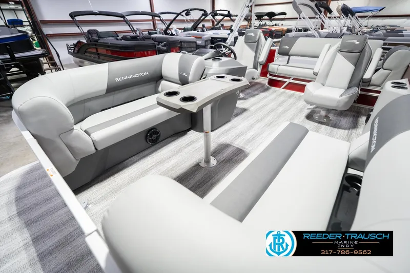 Slide: The Image of 2026 Bennington 20 SSR pontoon boat interior with plush seating and modern design. - 12