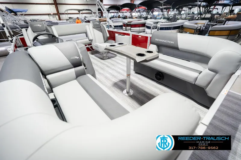 Slide: The Image of 2026 Bennington 20 SSR pontoon boat interior with gray seating and cup holders. - 13