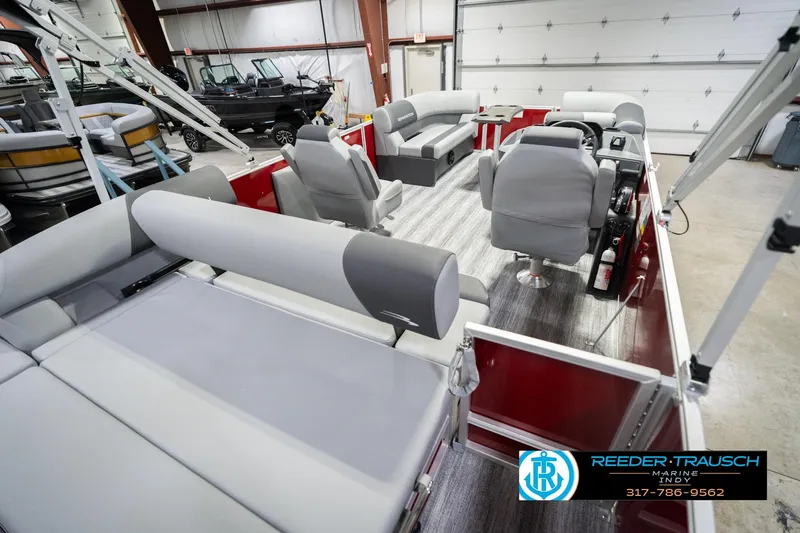 Slide: The Image of 2026 Bennington 20 SSR pontoon boat interior with gray seating in a showroom. - 14