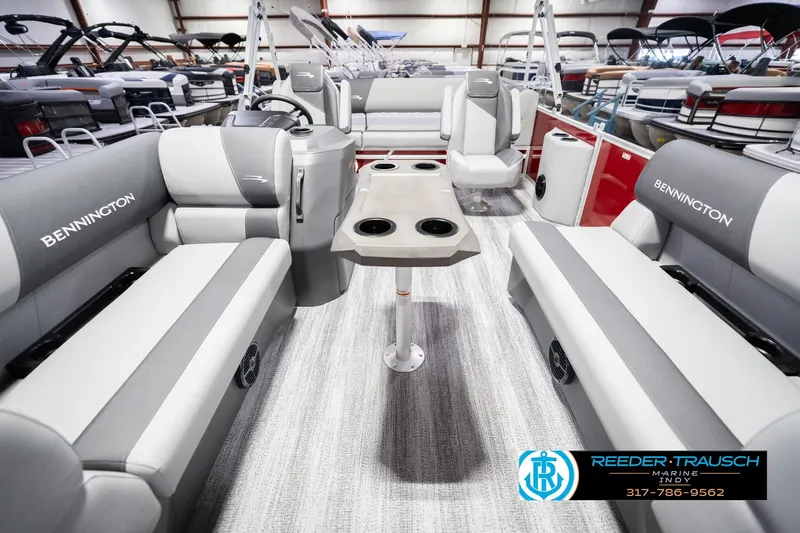 Slide: The Image of 2026 Bennington 20 SSR pontoon boat interior with gray seating and central table. - 16