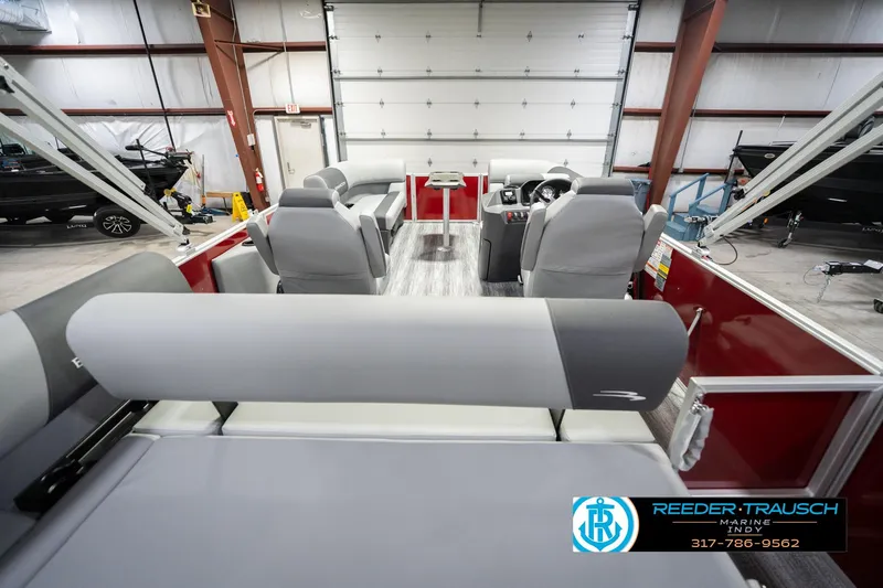 Slide: The Image of 2026 Bennington 20 SSR pontoon boat interior with gray seating in a showroom. - 19