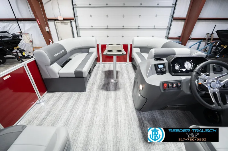 Slide: The Image of 2026 Bennington 20 SSR pontoon boat interior with gray seating and modern dashboard. - 20
