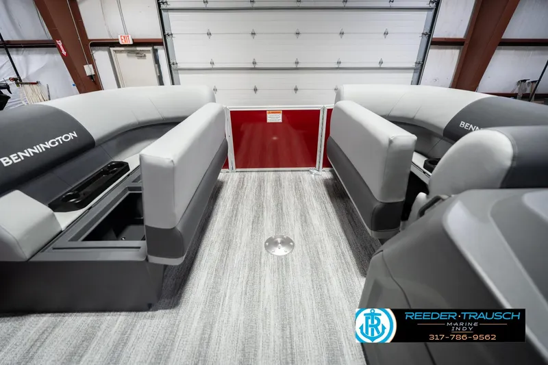 Slide: The Image of 2026 Bennington 20 SSR pontoon boat interior with gray seating and storage compartments. - 23