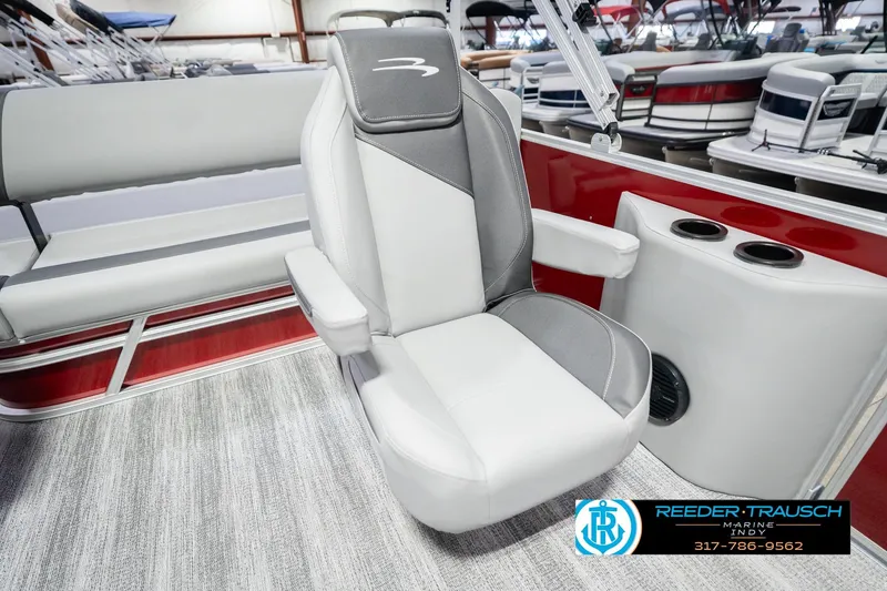 Slide: The Image of 2026 Bennington 20 SSR boat interior with gray and white seating, cup holders, and carpeted flooring. - 25