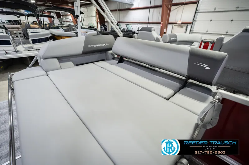 Slide: The Image of 2026 Bennington 20 SSR pontoon boat interior with gray seating in showroom. - 27