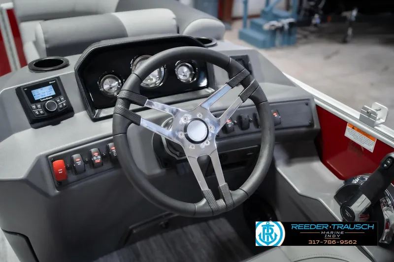Slide: The Image of 2026 Bennington 20 SSR boat dashboard with steering wheel and control panel. - 29