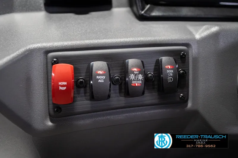 Slide: The Image of Control panel of 2026 Bennington 20 SSR boat with labeled switches for horn, radio, and lights. - 31