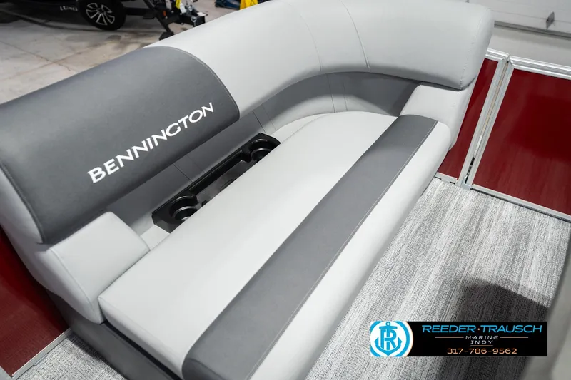 Slide: The Image of 2026 Bennington 20 SSR boat interior with gray seating and cup holders. - 42