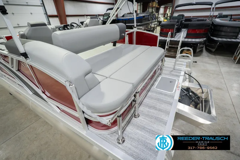 Slide: The Image of 2026 Bennington 20 SSR pontoon boat with gray seating in showroom. - 56