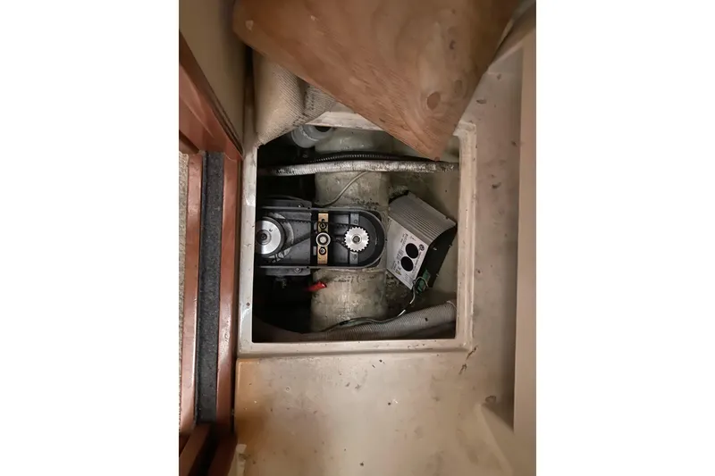 Slide: The Image of 2005 Carver 38 Super Sport boat interior with white seating and helm station. - 16