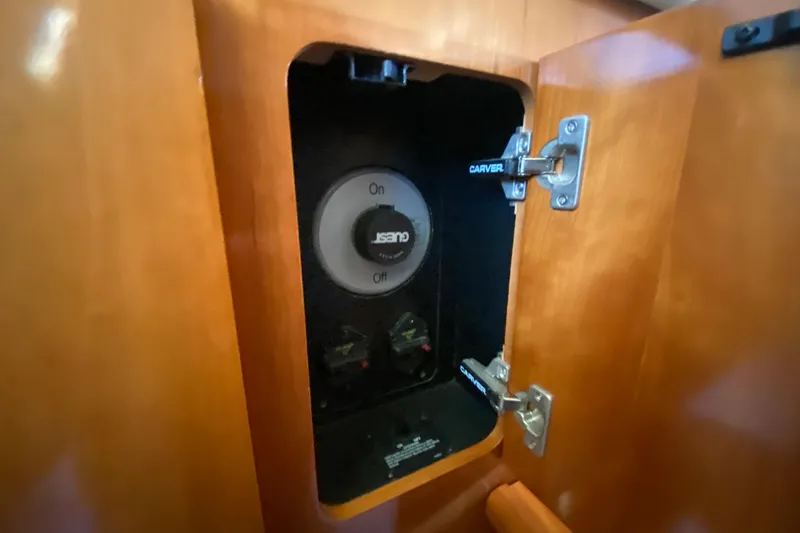 Slide: The Image of Luxurious bedroom interior of 2005 Carver 38 Super Sport yacht with nautical-themed bedding. - 26