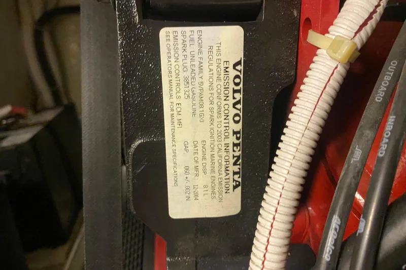 Slide: The Image of Open wooden cabinets inside a 2005 Carver 38 Super Sport boat interior. - 34