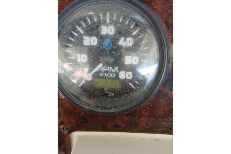 Slide: The Image of Control panel on a 2005 Carver 38 Super Sport boat, featuring start/stop buttons and circuit breakers. - 39