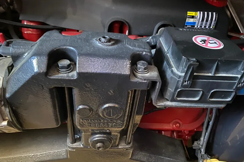 Slide: The Image of Engine component of a 2005 Carver 38 Super Sport boat, featuring detailed mechanical parts. - 42