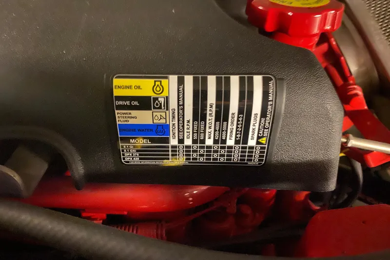 Slide: The Image of Engine label on a 2005 Carver 38 Super Sport, detailing oil and fluid specifications. - 44