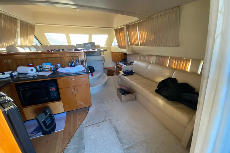 Slide: The Image of 2005 Carver 38 Super Sport yacht interior with carpeted floor and sliding glass doors. - 7