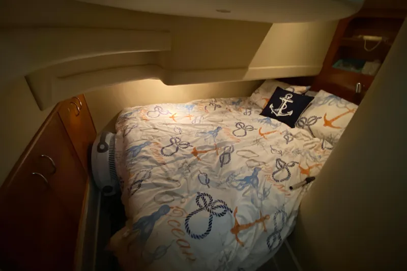 Slide: The Image of 2005 Carver 38 Super Sport boat deck with two white chairs and carpet. - 17