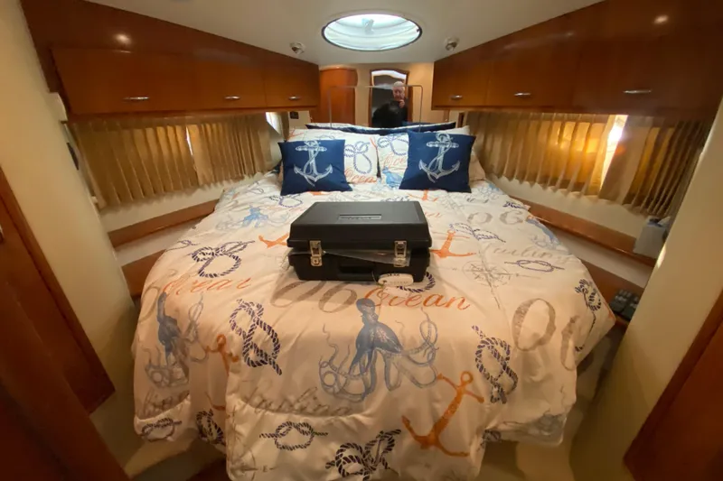 Slide: The Image of 2005 Carver 38 Super Sport yacht kitchen with stove, sink, and microwave. - 21