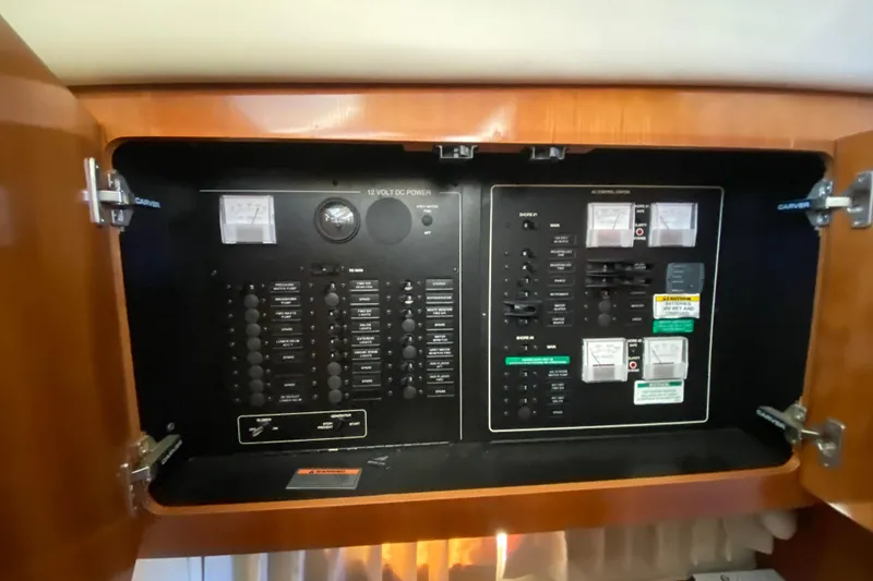 Slide: The Image of Electrical control panel of a 2005 Carver 38 Super Sport boat. - 25