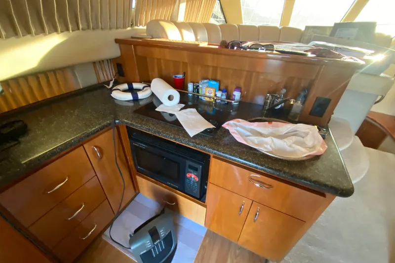 Slide: The Image of Cozy bedroom in 2005 Carver 38 Super Sport yacht with nautical-themed bedding. - 27