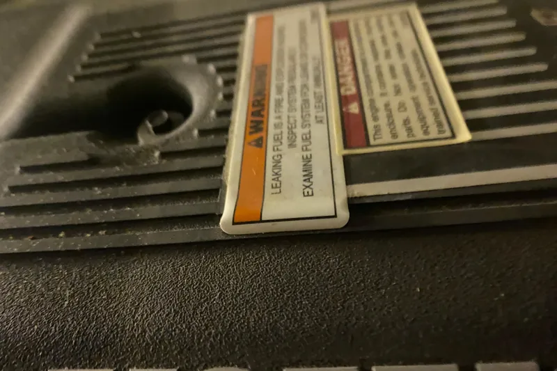 Slide: The Image of Luxurious 2005 Carver 38 Super Sport yacht bedroom with nautical-themed bedding and elegant wood cabinetry. - 29