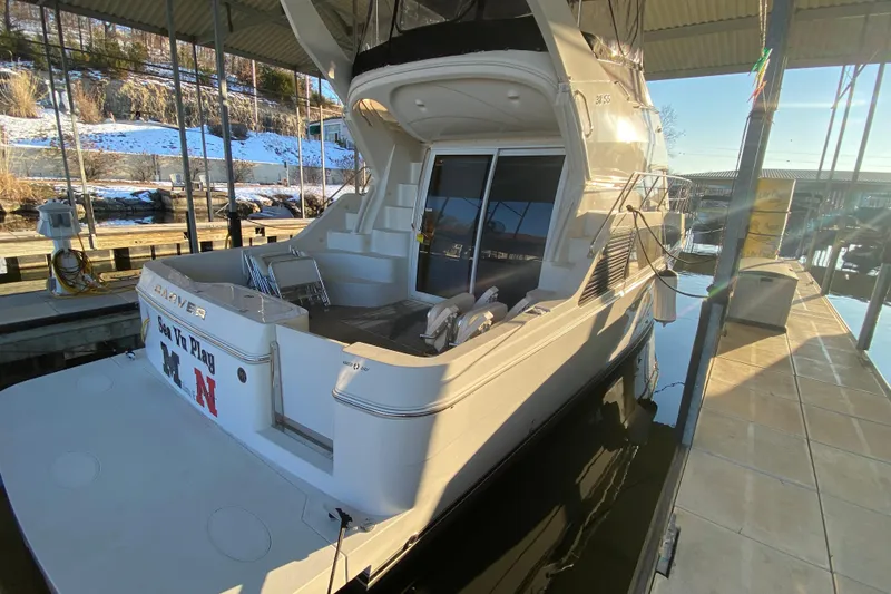 Slide: The Image of 2005 Carver 38 Super Sport yacht docked under a covered marina. - 3
