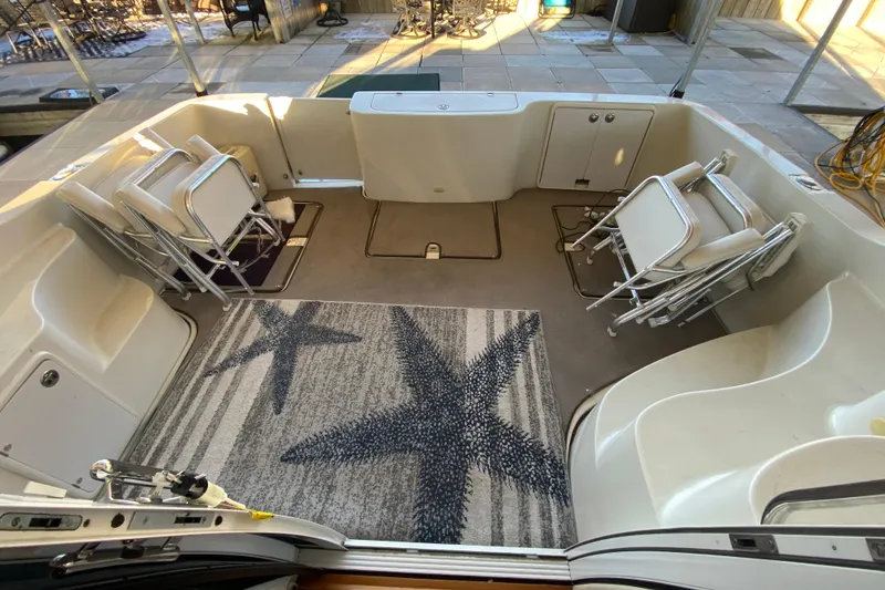 Slide: The Image of 2005 Carver 38 Super Sport engine compartment with visible machinery and components. - 37