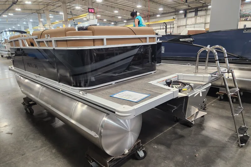 Slide: The Image of 2026 Avalon VENTURE CRUISE pontoon boat in a factory setting. - 11