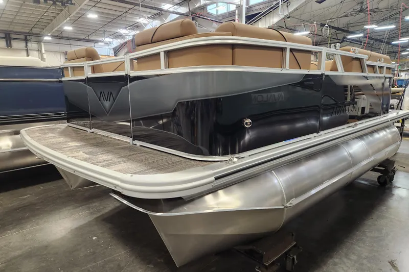 Slide: The Image of 2026 Avalon VENTURE CRUISE pontoon boat in a factory setting, showcasing sleek design. - 14
