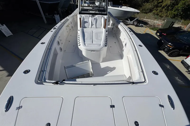 Slide: The Image of 2026 Caymas 44 CT boat deck with seating and storage compartments. - 15
