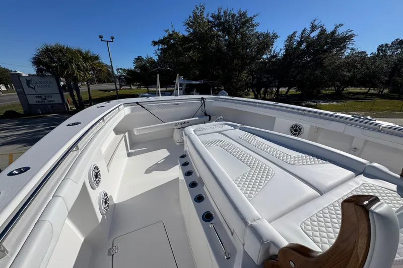 Slide: The Image of 2026 Caymas 44 CT boat interior with white seating and modern design. - 19